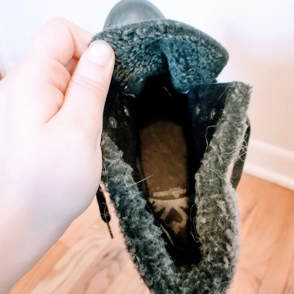 Ankle boots with heel and fur around the ankle.  Minor wear at the heel inside t